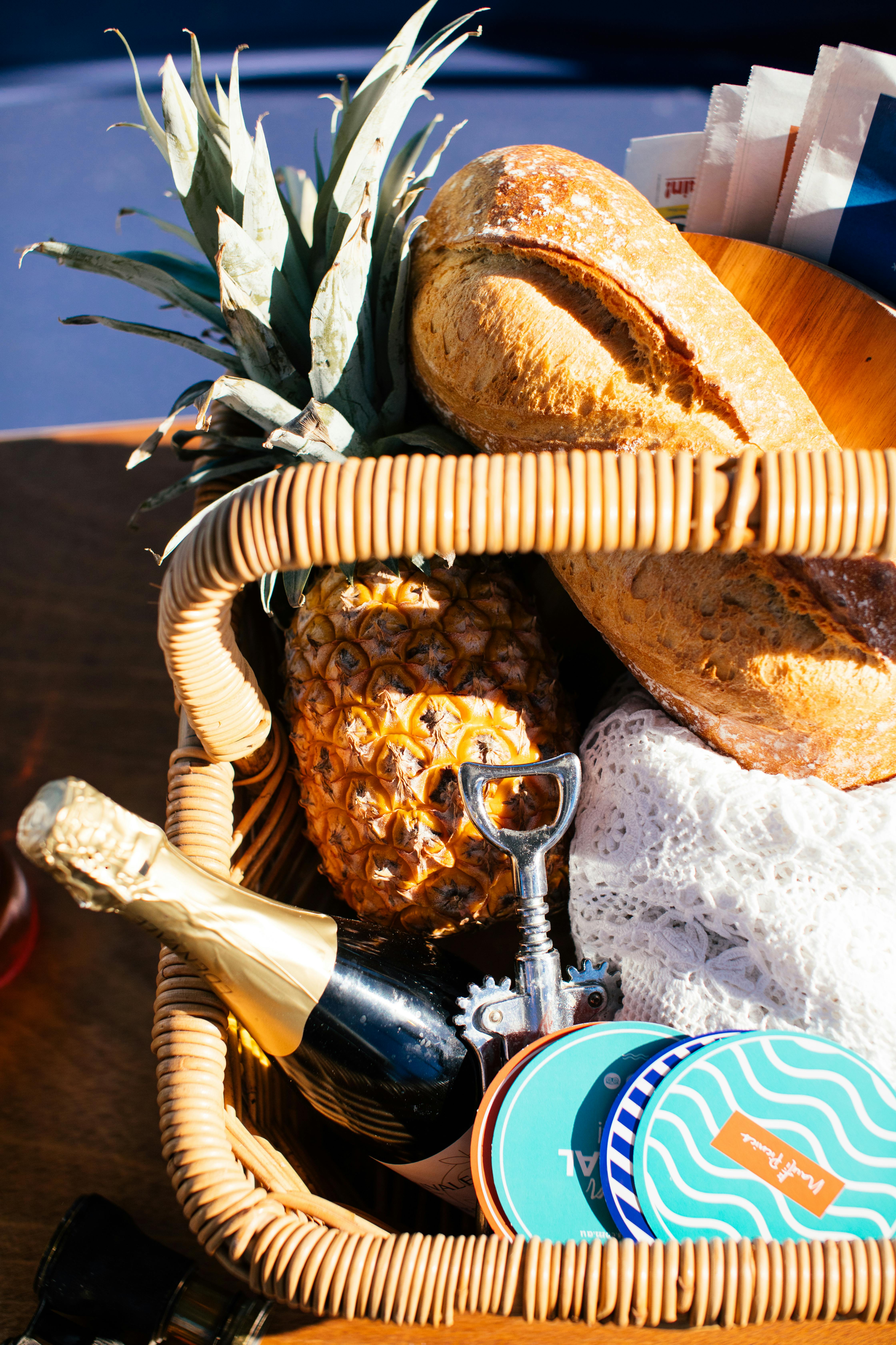 wicker basket with food and wine