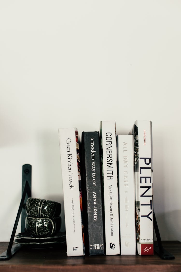 Pile Of Books On Shelf