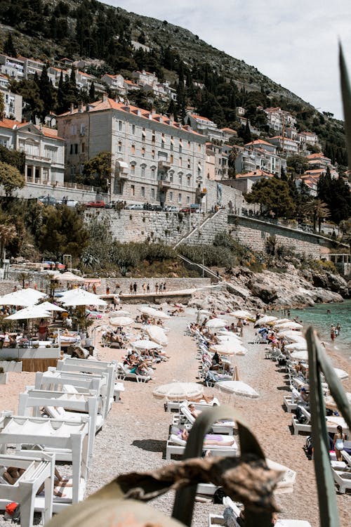 Sandy beach with sunbathing people