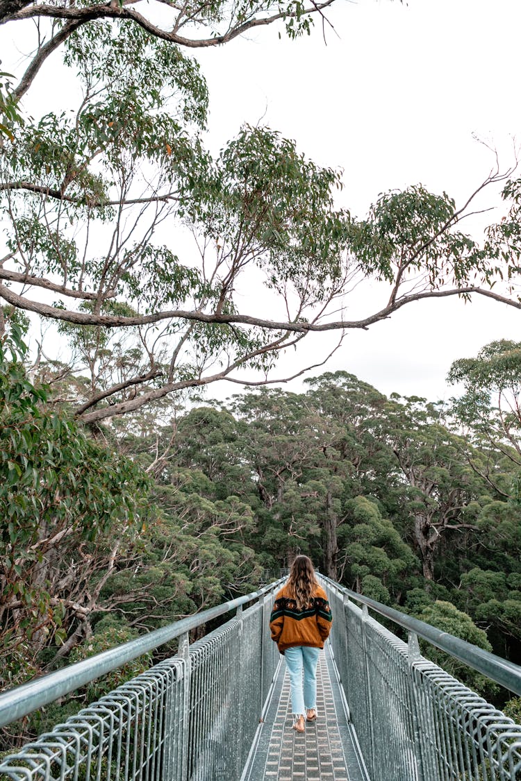 Anonymous Woman On Metal Footbridge