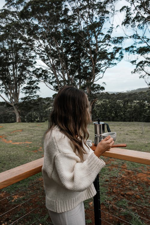 Woman Drinking Coffee on Terrace