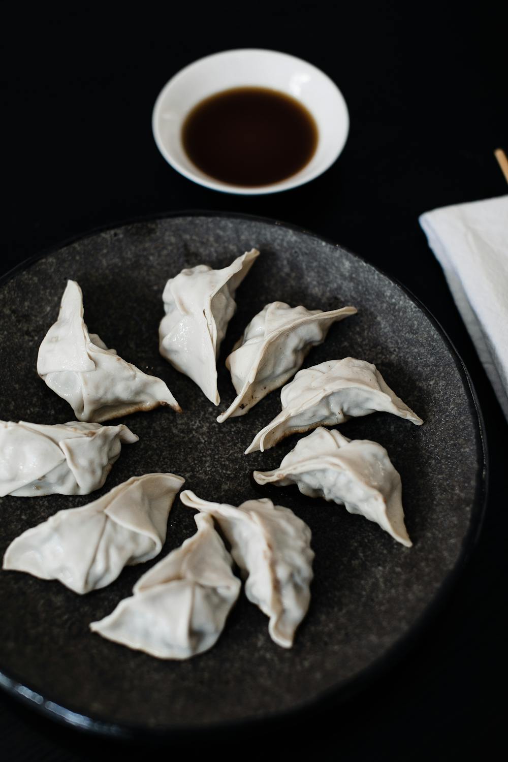 Plate with Japanese dumplings on table · Free Stock Photo
