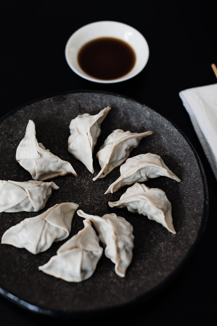 Plate With Japanese Dumplings On Table