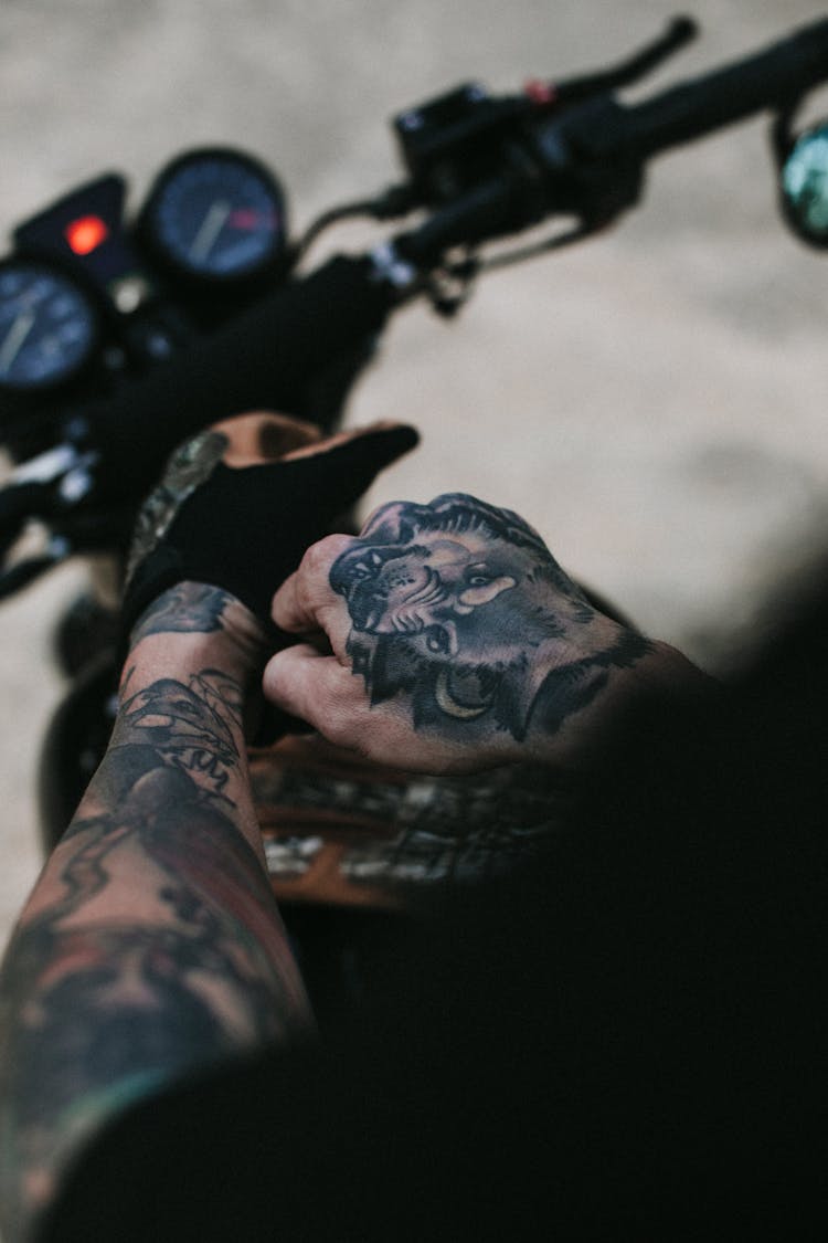 Crop Man With Gloves On Motorcycle