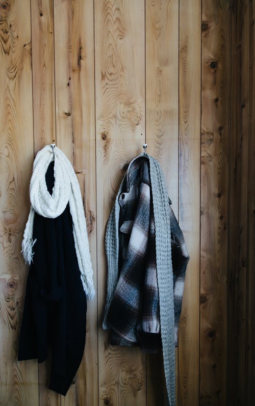 Clothes hanging on hooks on wall