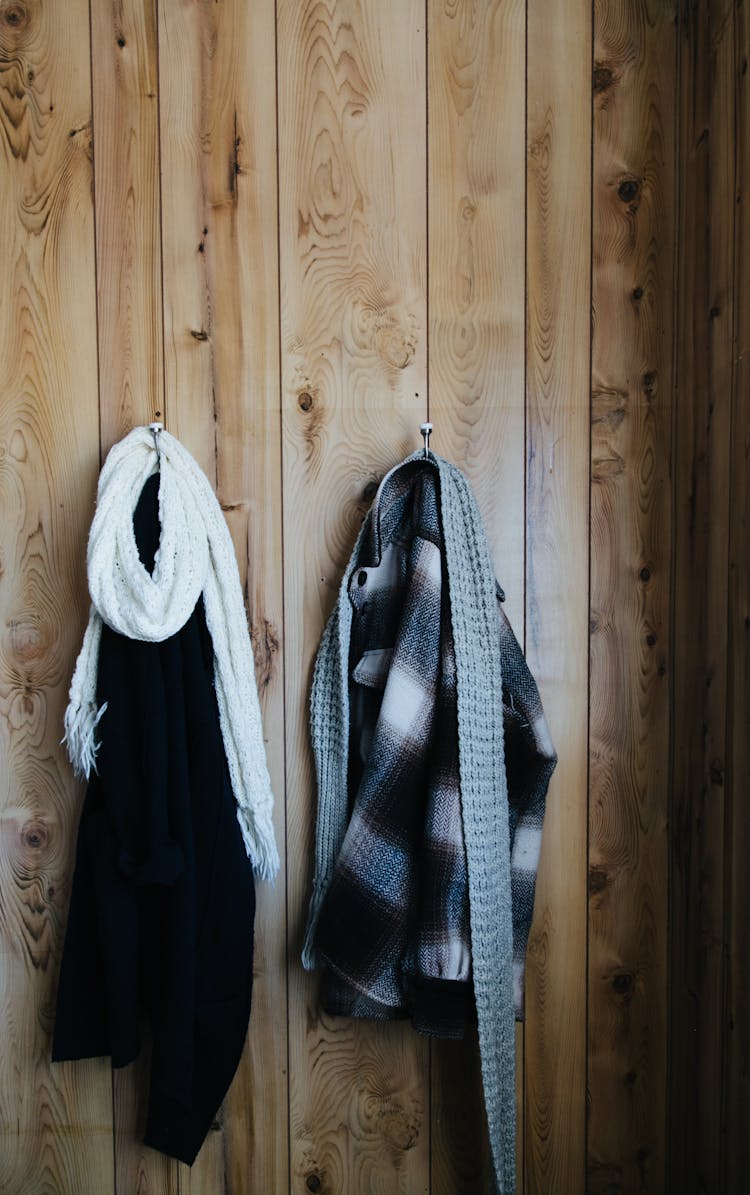 Clothes Hanging On Hooks On Wall