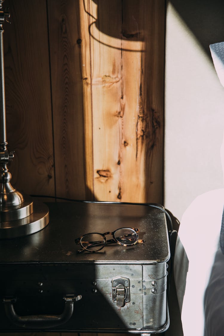 Glasses On Metal Case In Bedroom