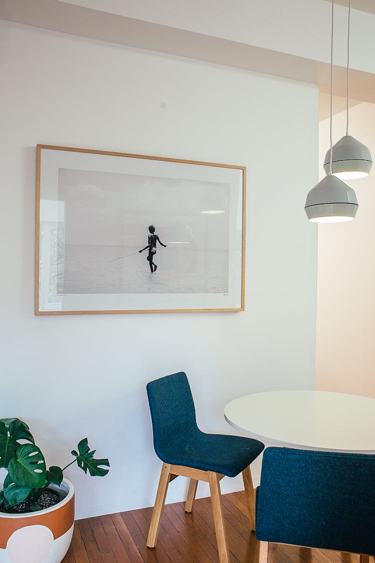 Interior Of Room With Chairs And Table Near Picture