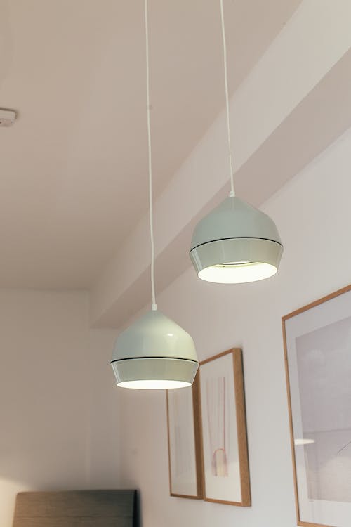 Lamps hanging from ceiling in room