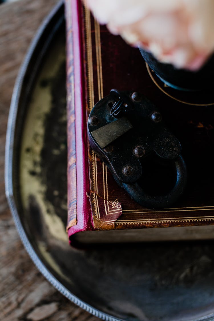 Old Black Lock Placed On Book