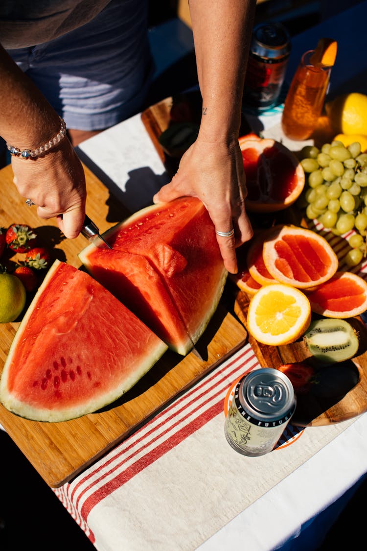 Person Slicing Sweet Watermelon 