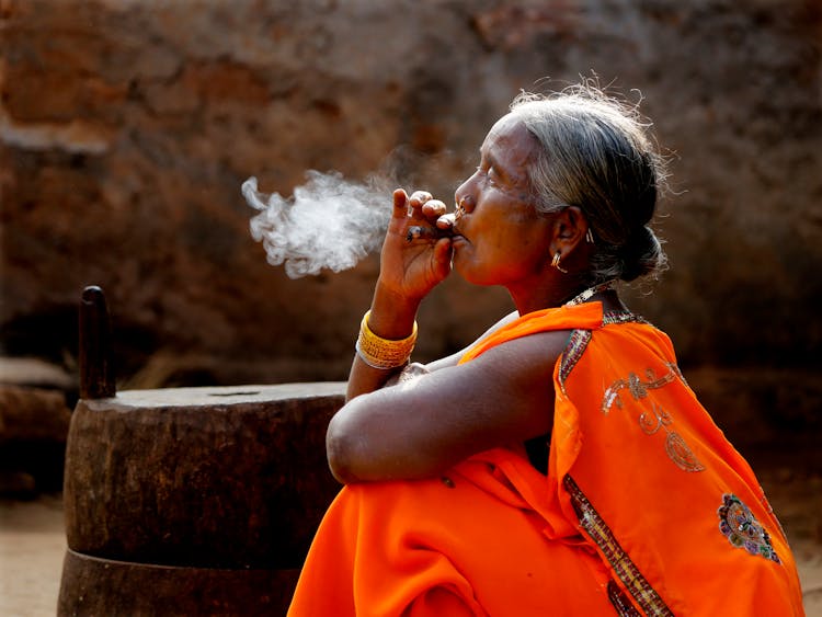 Elderly Woman Smoking Tobacco