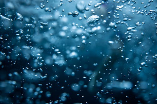 Free Air Bubbles in Blue Water Stock Photo