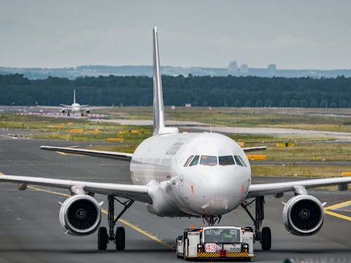 Aircraft Tug Pulling an Aircraft