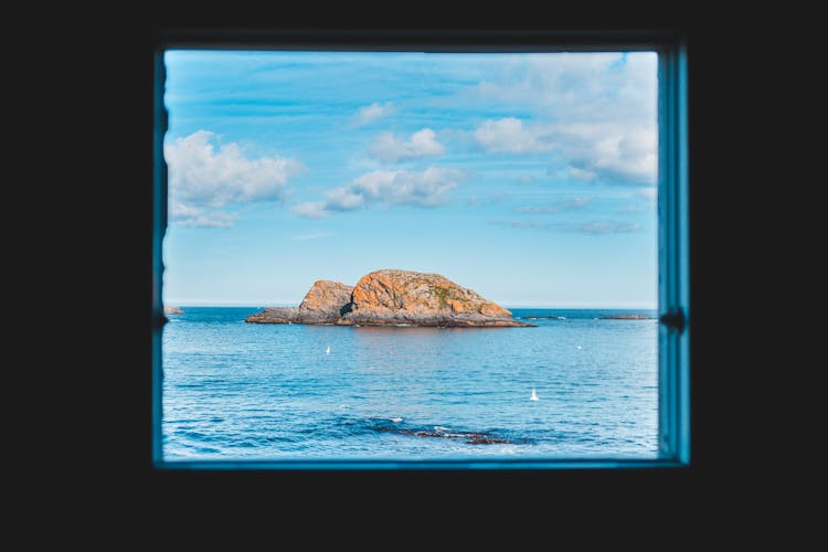 View Through Window On Rock In Sea