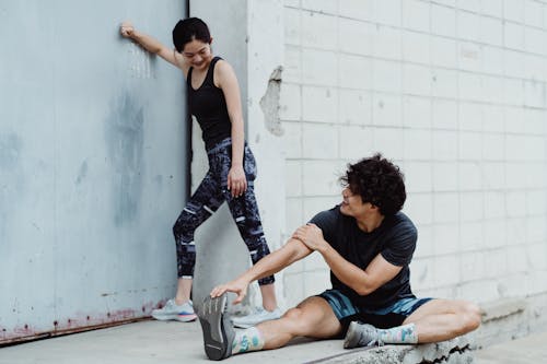 Man and Woman Exercise Together