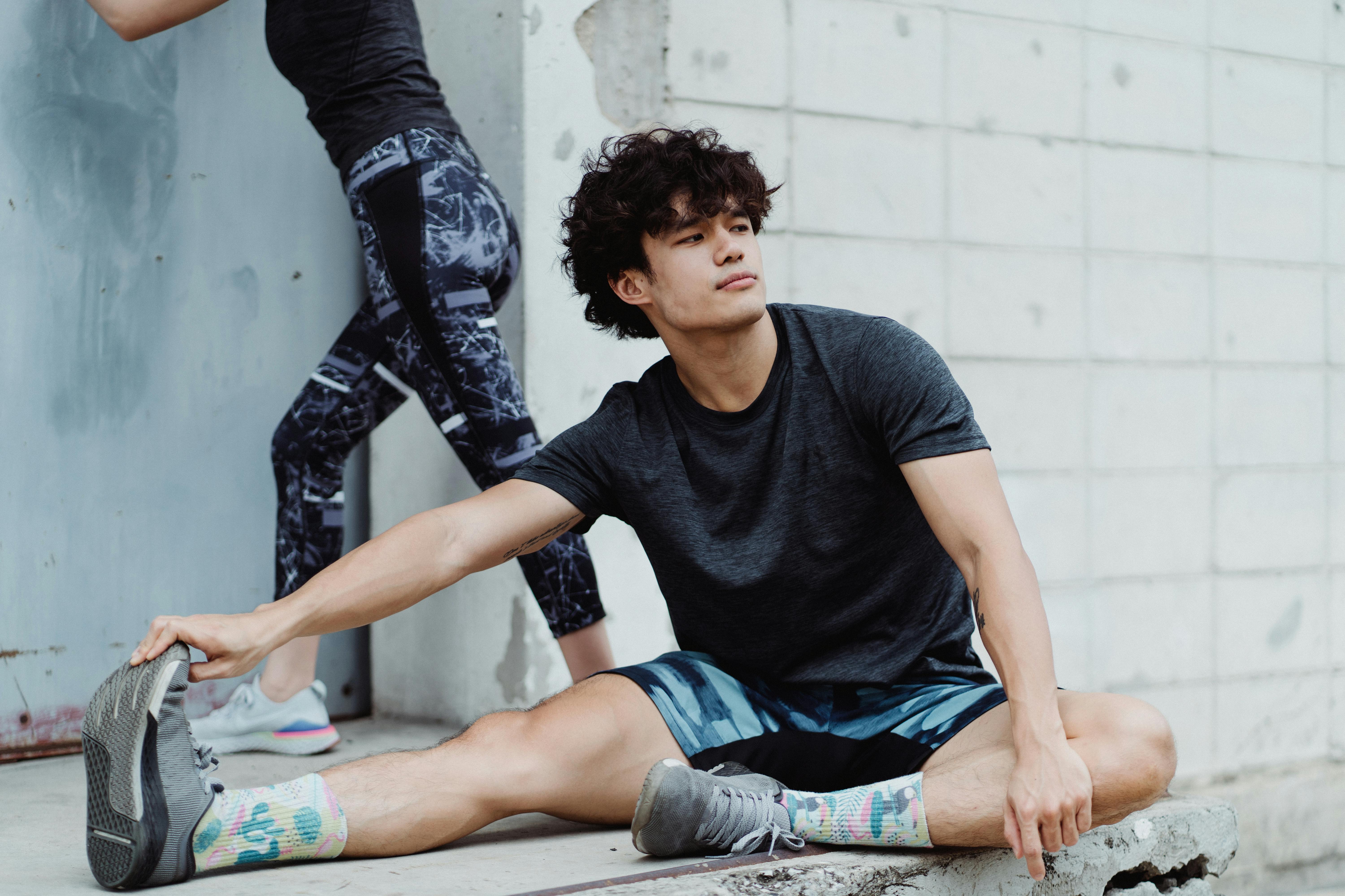 Smiling Young Couple Training Outside Together · Free Stock Photo