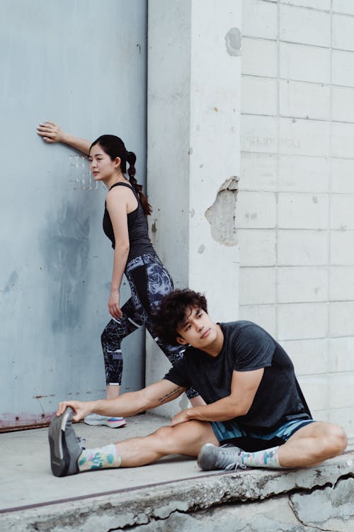 Man and Woman Exercise Together