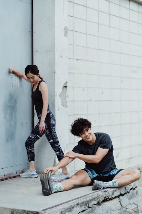 Man and Woman Exercise Together