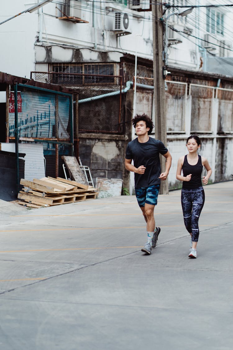 A Man And A Woman Jogging 