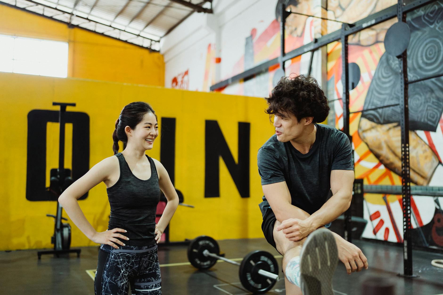 Revolutionize Your Fitness Routine with These 5 Mind-Blowing Wall Mount Exercise Equipment Ideas 7 https://www.pexels.com/photo/photo-of-a-man-talking-with-a-woman-at-the-gym-4853261/