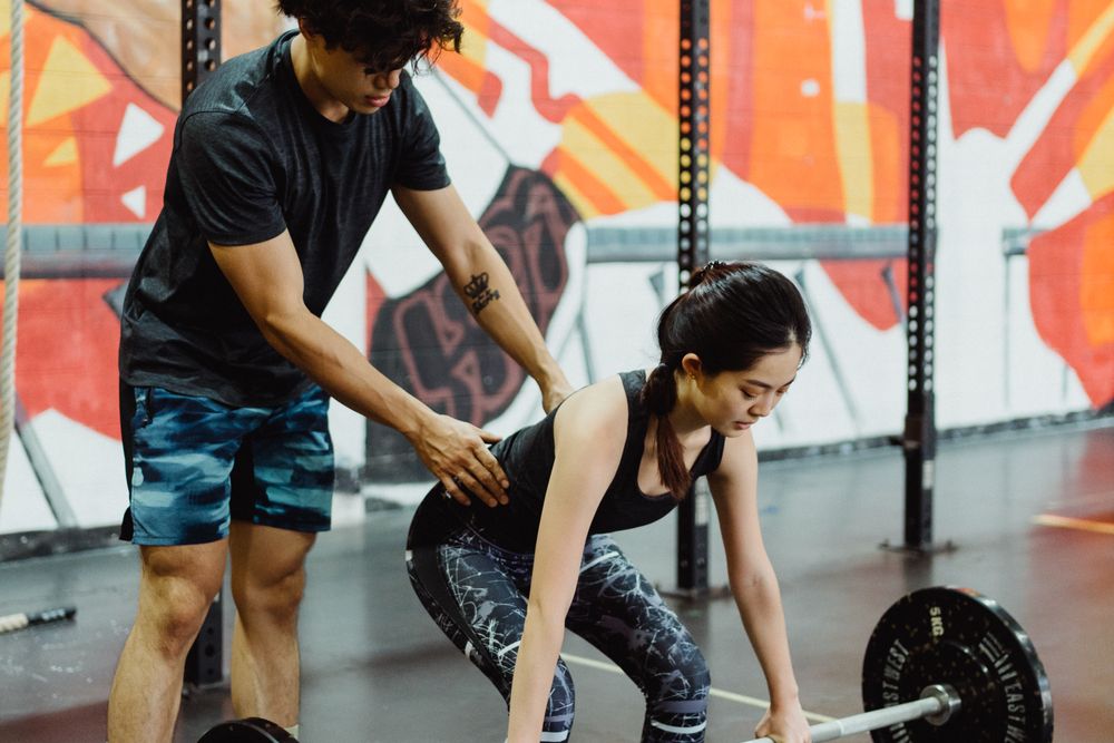 Instructor patiently coaching a nervous beginner through a new skill