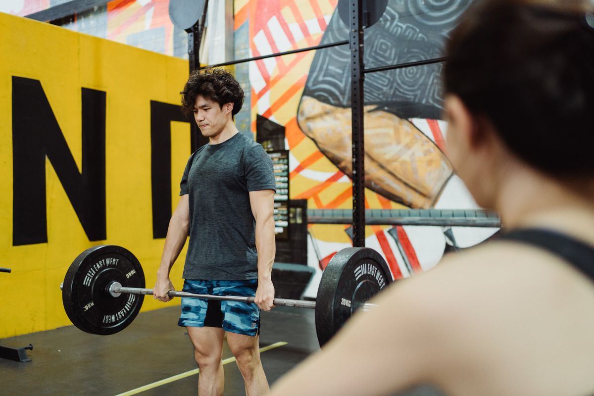 Adult performing resistance training with weights to preserve Type II muscle fibers and bone density after 40