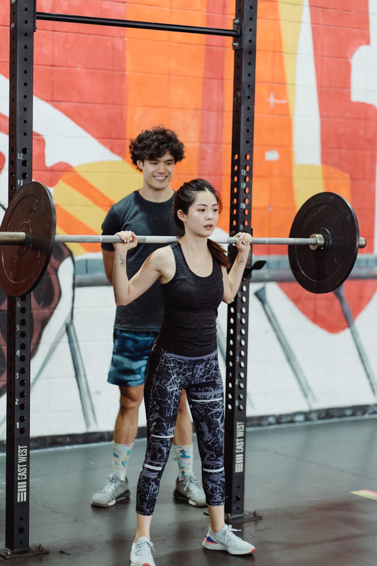 A Woman Working Out At A Gym