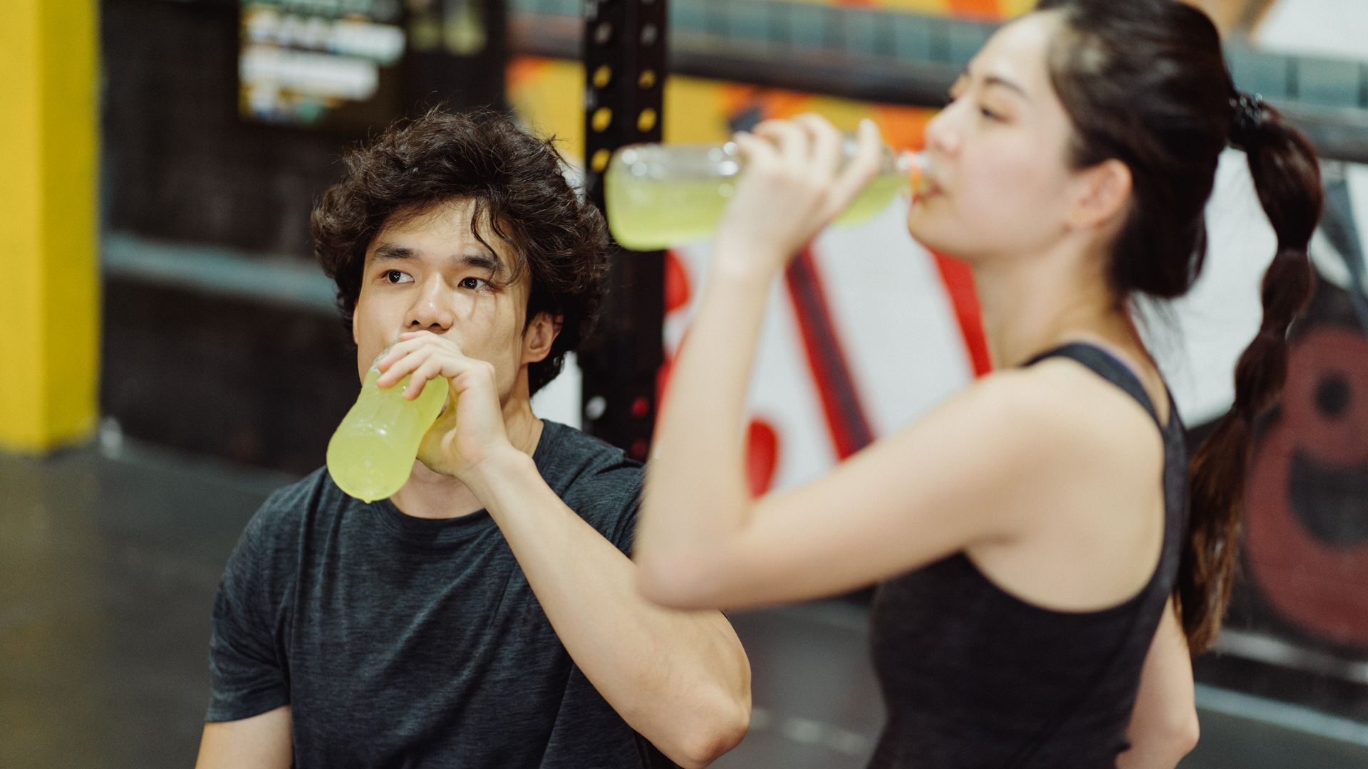 Why Does Modafinil Make You Thirsty: Understanding the Mechanism Young Asian couple drinking energy drinks in the gym for hydration post-workout — why does modafinil make you thirsty