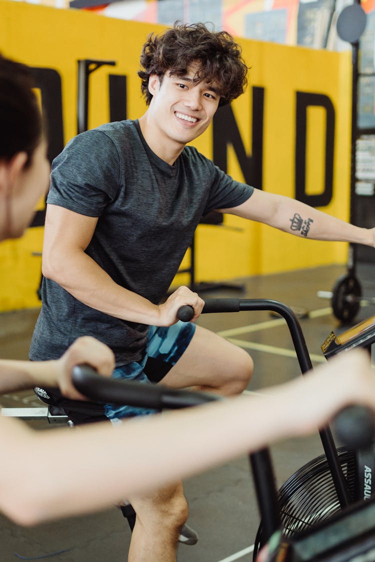 A Man Using An Elliptical Trainer