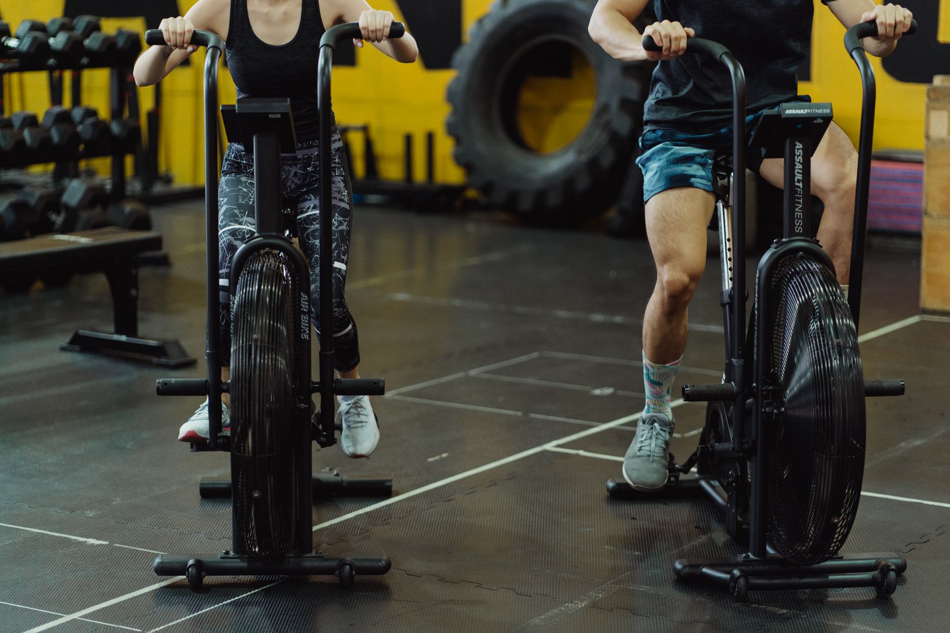 Two people train on stationary bikes, a typical low-intensity aerobic setting.