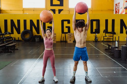 Free A Couple Working Out with Medicine Balls Stock Photo