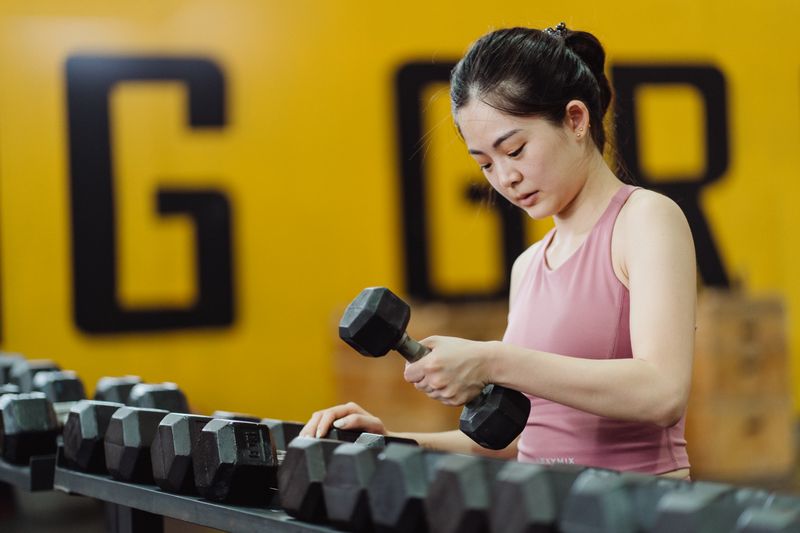 Woman lifting a dumbbell during a workout