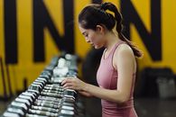Woman in Pink Tank Top Holding Clear Glass Jar