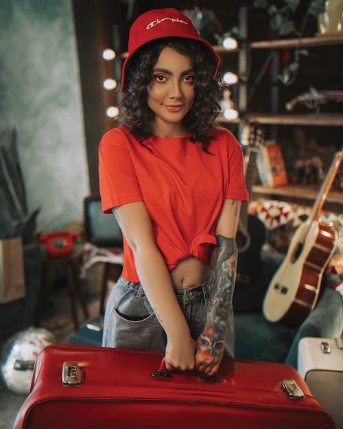 Free Stylish woman with retro suitcase Stock Photo