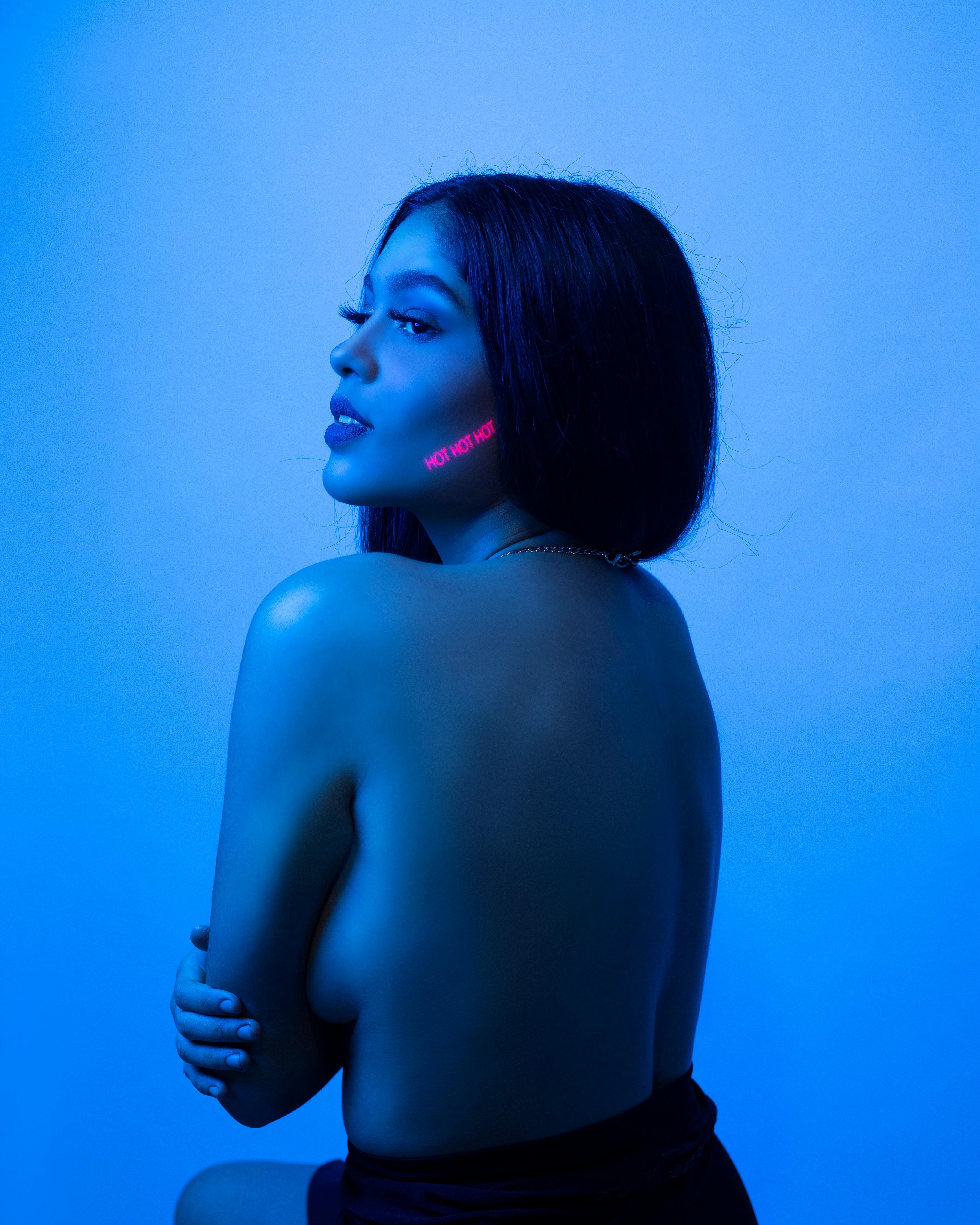 topless model in blue light