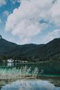 Picturesque scenery of turquoise lake and clouds