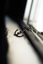 Metal anchor shaped pendent on shabby windowsill