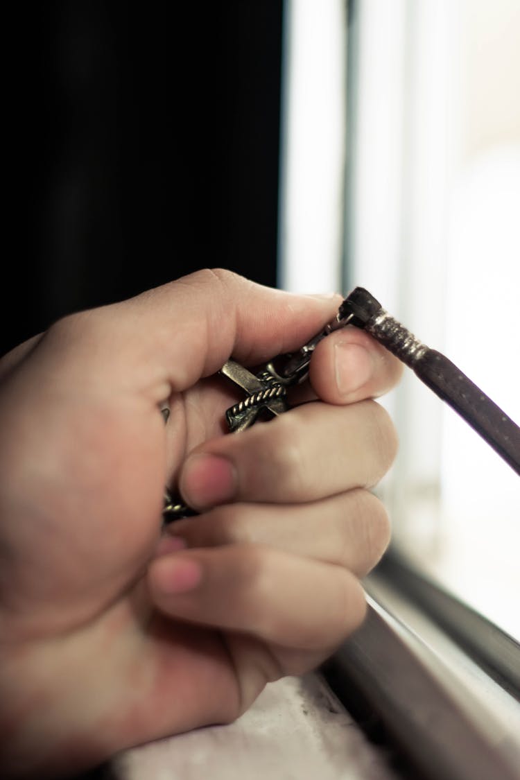 Crop Faceless Man Clutching Metal Keyring