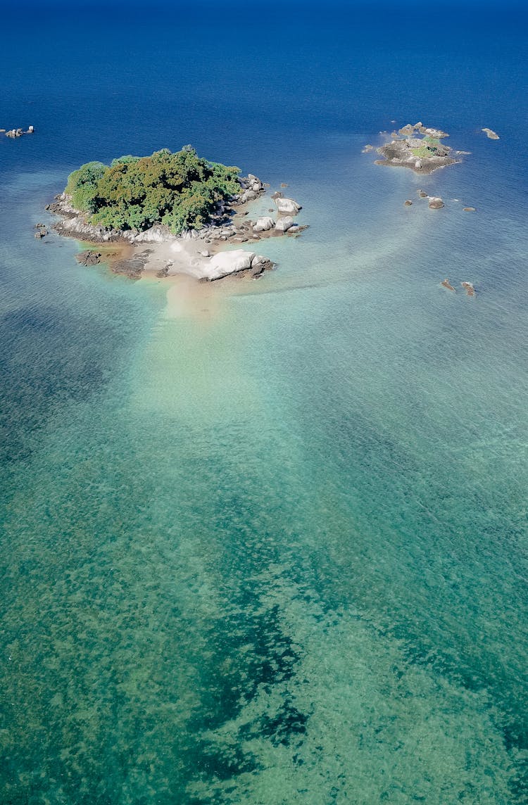 Tropical Islet In Azure Shallow Sea