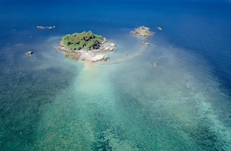 Exotic Green Island In Calm Ocean