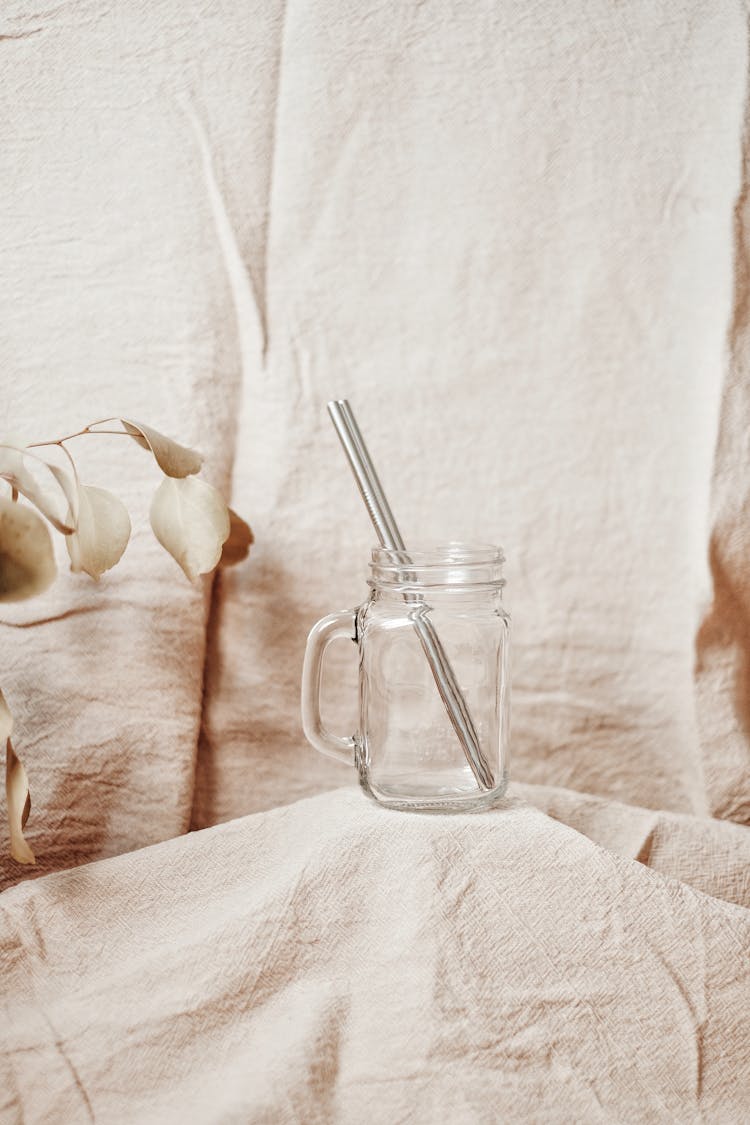 Photo Of A Metal Straw In A Glass Mug