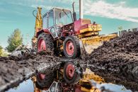 Yellow and Black Heavy Equipment on Brown Sand