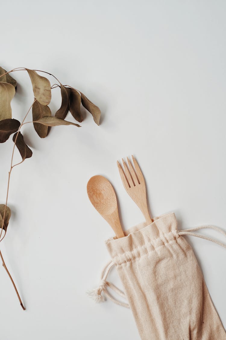 Overhead Shot Of A Wooden Spoon And Fork In A Pouch