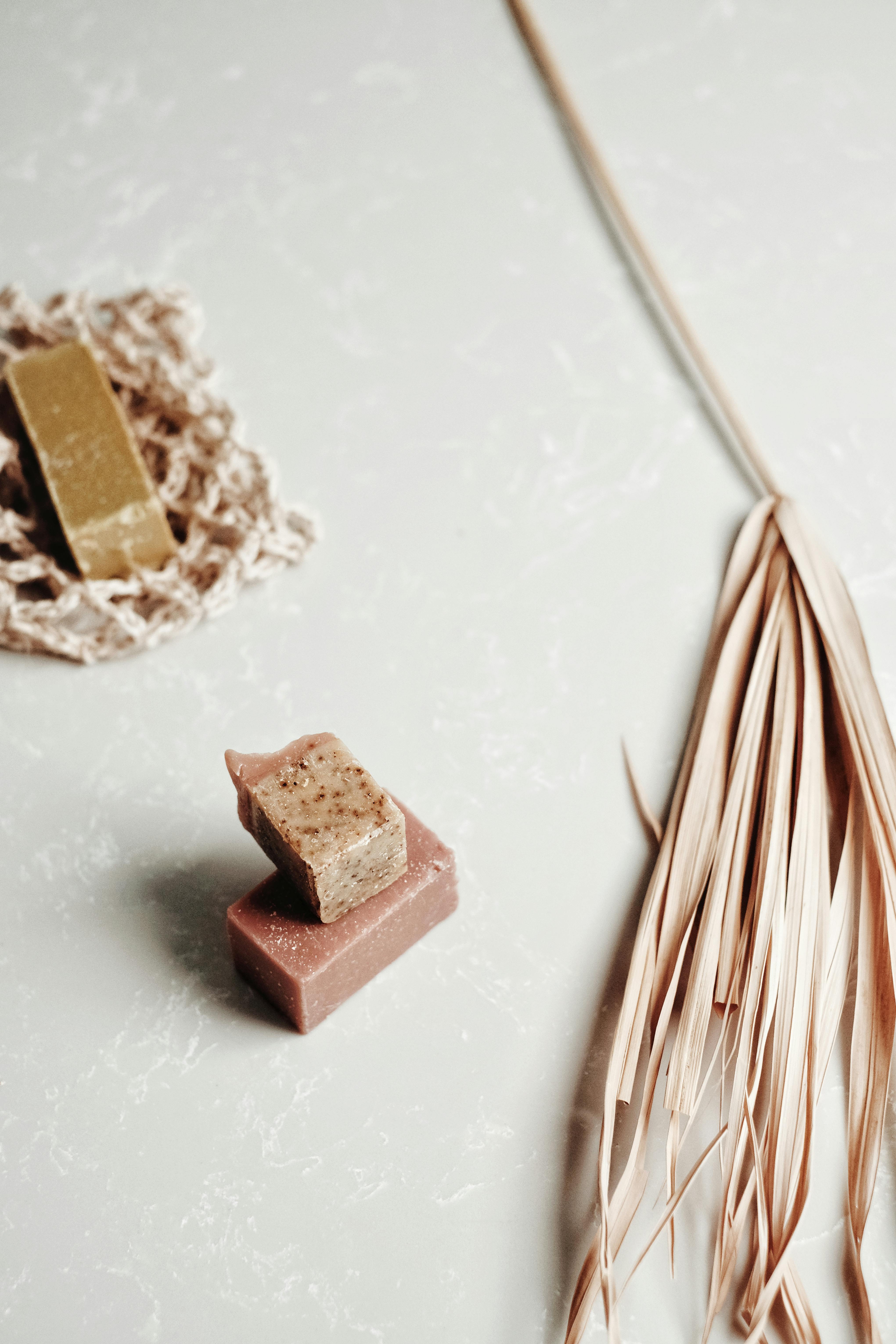 brown wooden stick on white and brown textile