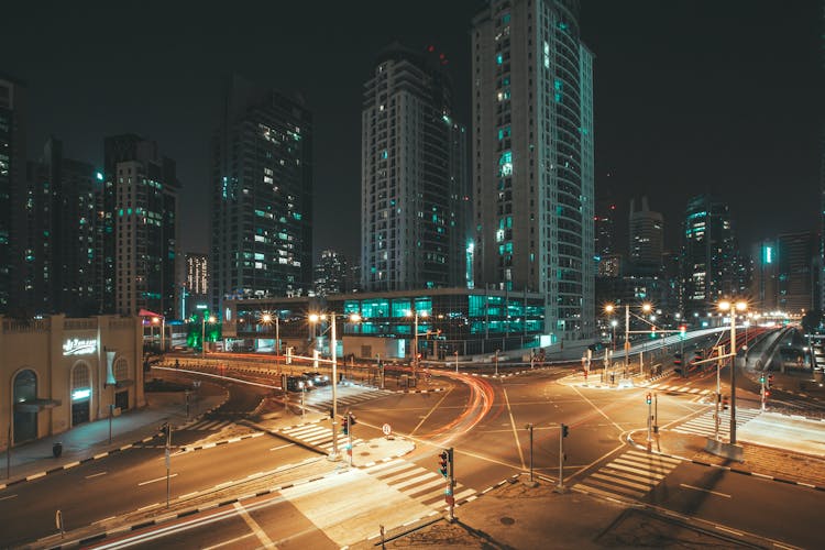 A View Of An Intersection At Night