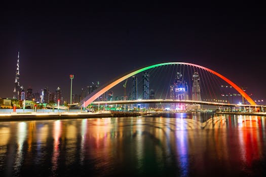 Stunning view of Dubai's Tolerance Bridge and Burj Khalifa skyline illuminated at night.