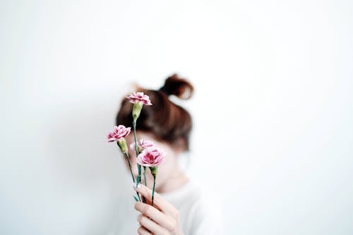 A Woman Holding Flowers 