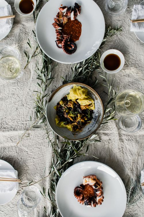 Free Top view of table with delicious fresh food and transparent glasses of wine served for banquet Stock Photo