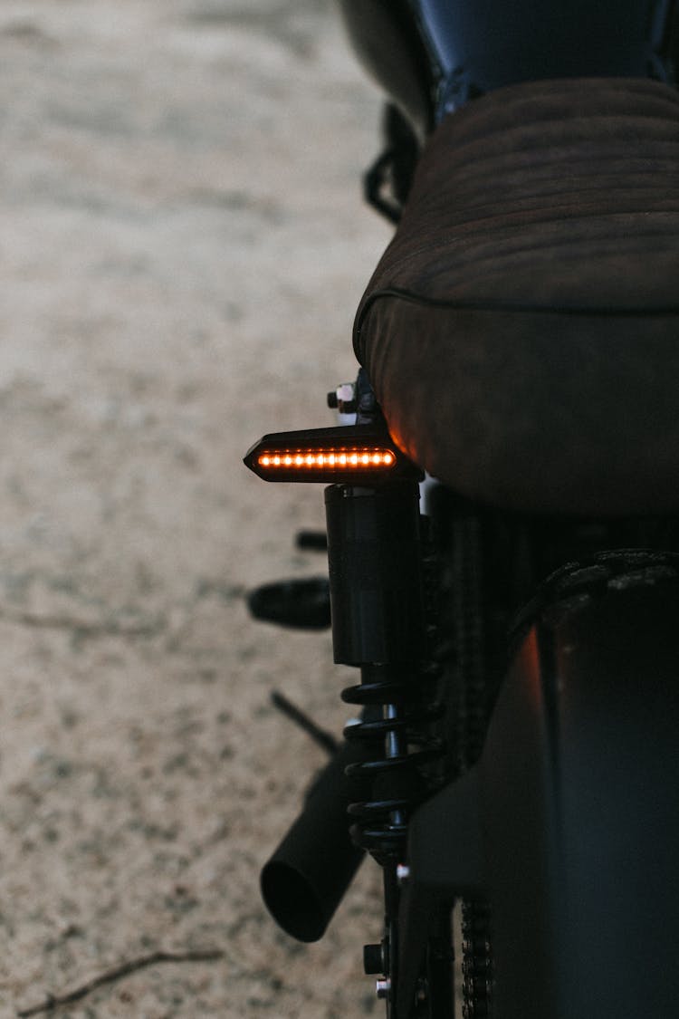 Metal Bike With Red Taillight On Road